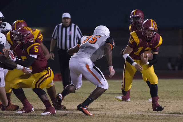 Del Sol’s Jason Hoyer (12) runs with the ball during a football game against Chaparral ...