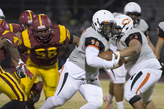 Chaparral’s Jacob Ford (30) runs with the ball during a football game at Del Sol in La ...