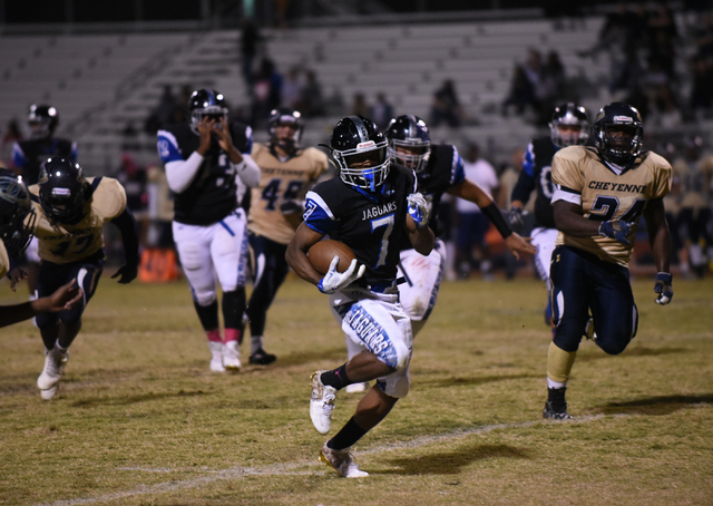 Desert Pines Isaiah Morris (7) runs down field against the Cheyenne defense during their foo ...