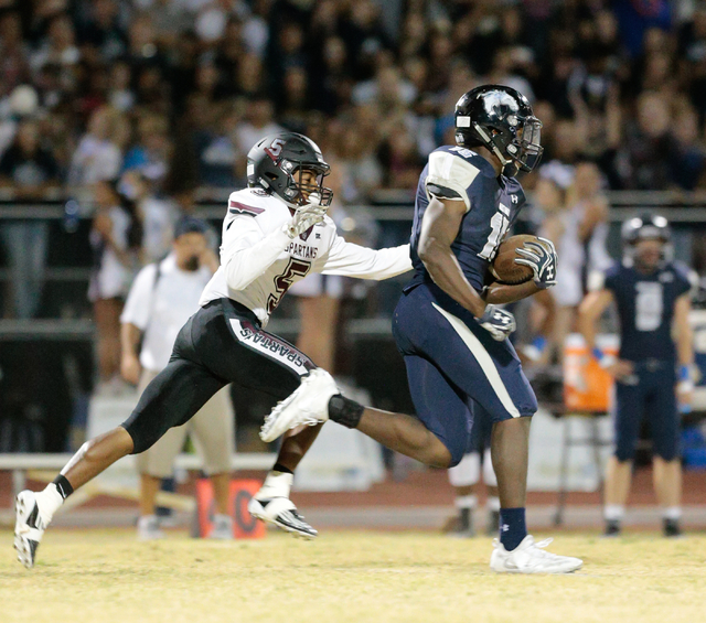 Shadow Ridge senior Malik Lindsey (15) runs the ball down the field as Cimarron-Memorial se ...