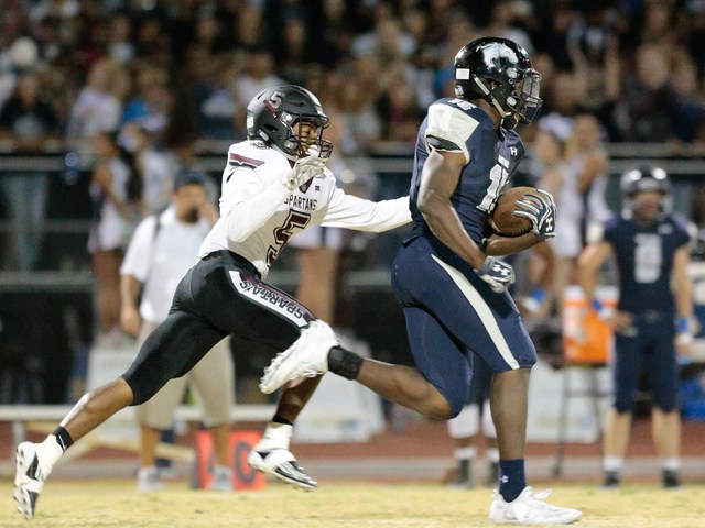 Shadow Ridge senior Malik Lindsey (15) runs the ball down the field as Cimarron-Memorial se ...