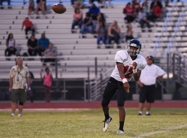 Las Vegas High School’s Zach Matlock (12) throws a pass against Palo Verde’s def ...