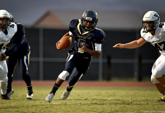 Cheyenne’s Derionte Green carries the ball against Foothill during a high school footb ...