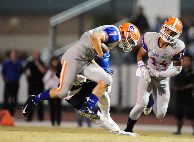 Bishop Gorman running back Biaggio Ali Walsh breaks the tackle of Sierra Vista safety Ka Kai ...