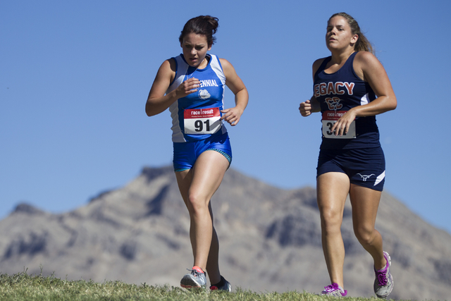 Centennial’s Lydia Sinyard, left, and Legacy’s Karli Cucchiara compete in the gi ...