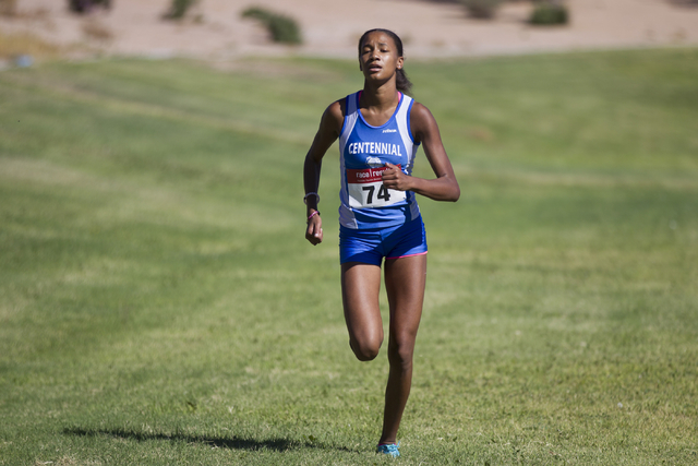 Centennial’s Alexis Gourrier runs to the finish line to take first place in the cross ...