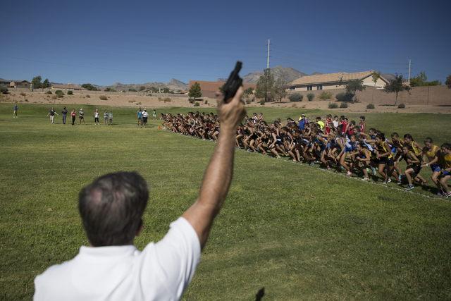 Girls varsity runners take off at the starting line in the cross country Palo Verde Labor Da ...