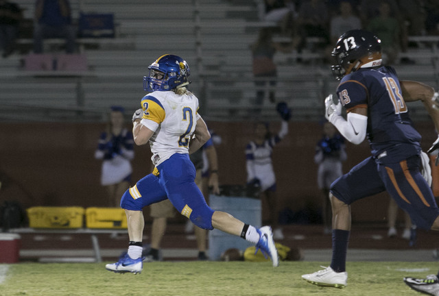 Moapa Valley’s Jacob Leavitt (2) runs for a touchdown against Legacy High during a va ...