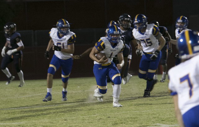 Moapa Valley’s Dalyn Leavitt (1) runs the ball against Legacy High during a varsity fo ...