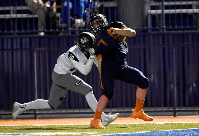 Bishop Gorman’s Biaggio Ali Walsh (7) carries the ball for a touchdown despite pressur ...