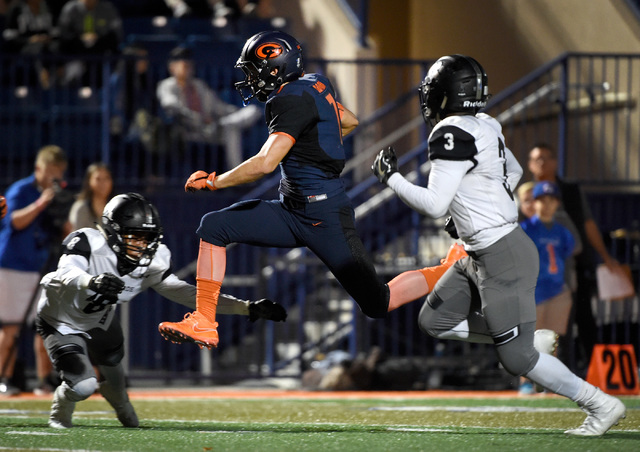 Bishop Gorman’s Biaggio Ali Walsh jumps through the Palo Verde defense Jamil Patton (8 ...