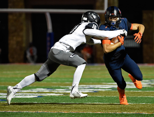 Bishop Gorman’s Biaggio Ali Walsh (7) carries the ball for against Palo Verde’s ...