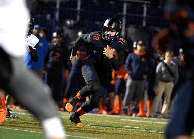 Bishop Gorman quarterback Tate Martell runs with the ball against Palo Verde during the firs ...