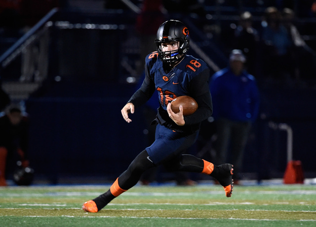 Bishop Gorman quarterback Tate Martell runs with the ball against Palo Verde during the firs ...