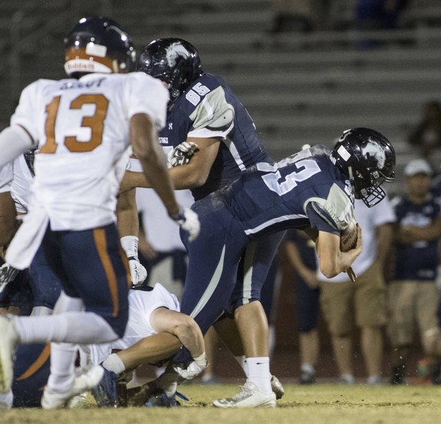 Quarterback Kody Presser (33) runs through the defensive line during a Legacy High School Sh ...