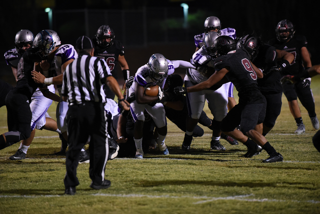 Silverado’s Nahzi Salih (9) runs down field against Desert Oasis defense during their ...