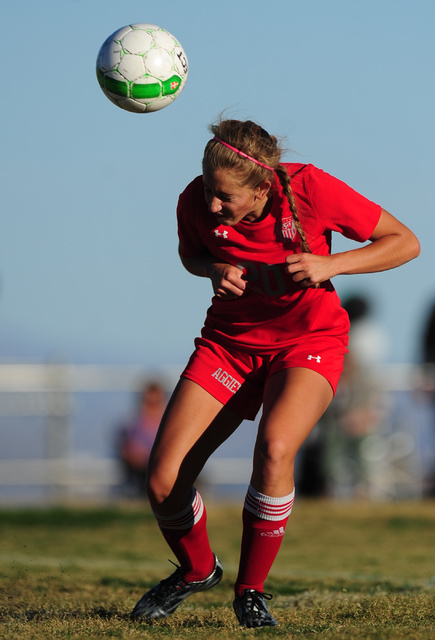 Arbor View forward Allyssa Larkin heads the ball against Palo Verde during their prep soccer ...