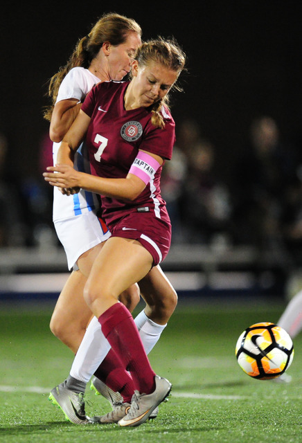 Desert Oasis defender Cayla Lee (7) and Bishop Gorman midfielder Taylor Cox collide during t ...