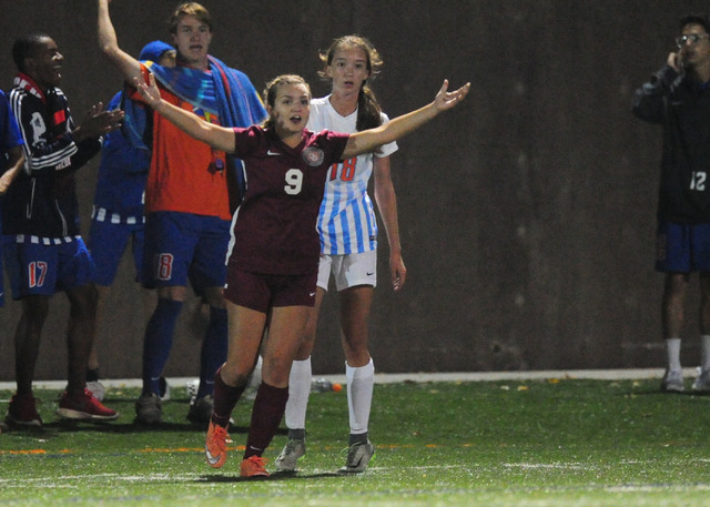 Desert Oasis midfielder Mia Blitsch (9) argues a questionable call after battling Bishop Gor ...