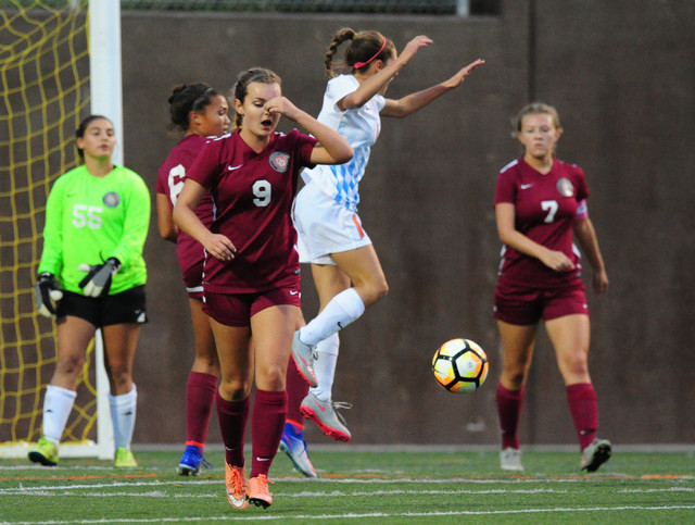 Bishop Gorman midfielder Jaden Terrana, center, celebrates a goal while Desert Oasis midfiel ...