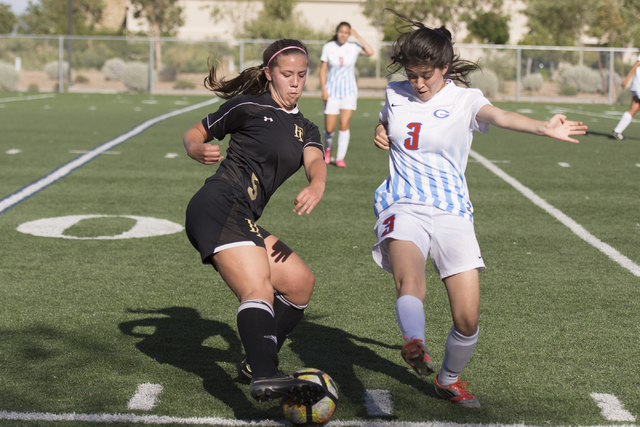 Bishop Gorman’s Bobbi Rivas (3) and Faith Lutheran’s Cameron Bracey (5) compete ...