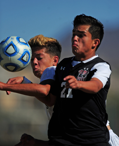 Las Vegas’ Agustin Hernandez (21) fights to head the ball against Coronado’s Jac ...