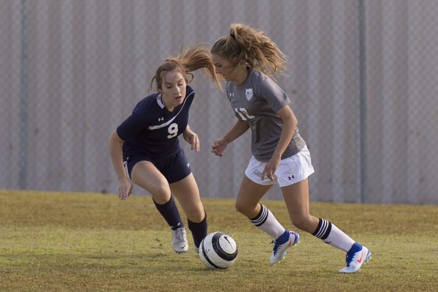 Centennial’s Brooke Hawley (9) and Arbor View’s Madison Carter (10) fight for th ...