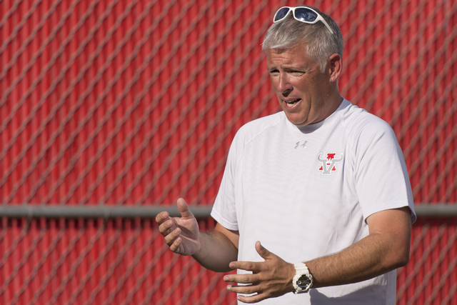 Arbor View’s girls soccer head coach Jay Howard speaks with his team at halftime durin ...