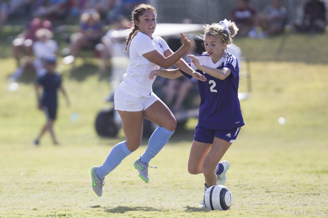 Foothill’s Amanda Carducci (6), left, runs with the ball with coverage from Silverado& ...