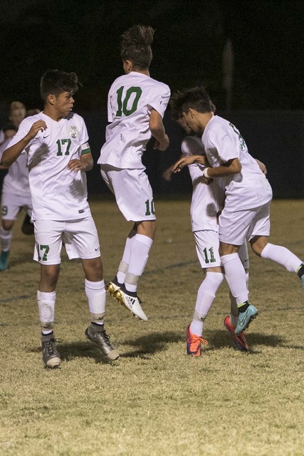 Green Valley defenders block a free kick from Foothill’s Reagan Mugume during a varsi ...