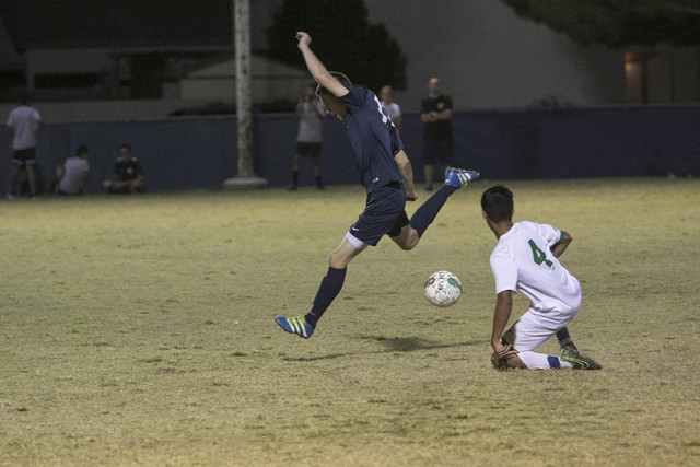 Foothill’s Stanley Henderson breaks away from Green Valley’s Thoren Kaufusi (4 ...