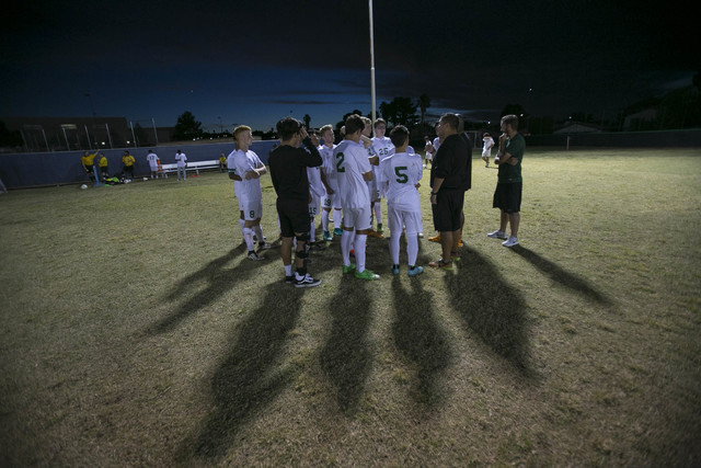 Green Valley soccer players gather at halftime against Foothill during a varsity game at Gre ...