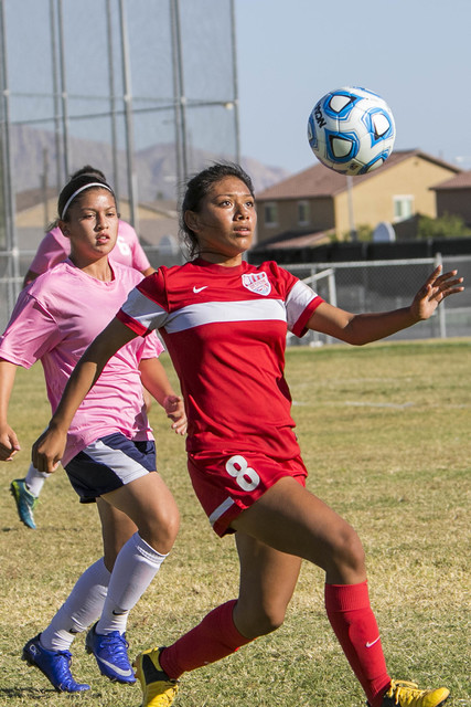 Western’s Vanessa Margarito (8) looks to gain control of the ball as she is chased by ...