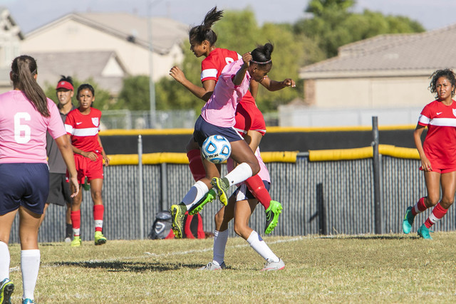 Cheyenne’s Mya Heard, front center, and Western’s Ellyson Reynada, top center, j ...