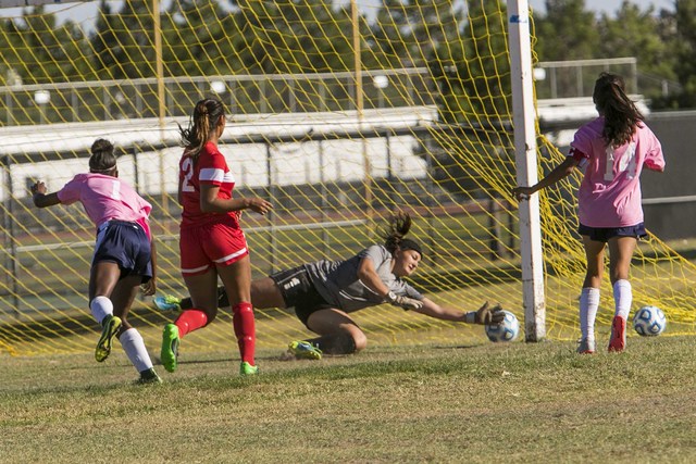 Cheyenne goalkeeper Shayna Thompson, second right, blocks a shot from Western’s Ellyso ...