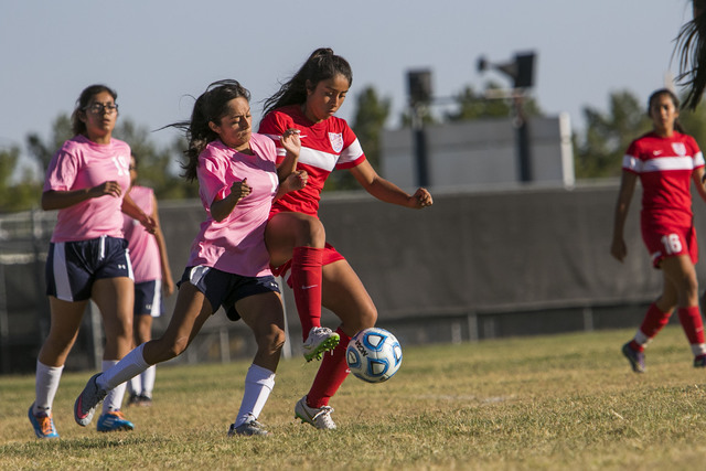 Cheyenne’s Laura Garcia, second left, and Western’s Adelina Jasso vie for a ball ...