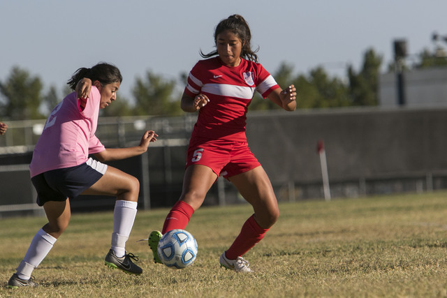 Cheyenne’s Bianca Navarro (12) and Western’s Adelina Jasso (5) vie for a ball du ...