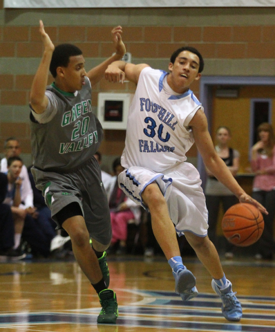 Foothill’s Austin Starr (30) drives past Green Valley’s Kelvin Omojola (20) on W ...