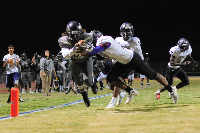 Cheyenne’s Khalil McKenzie (10) scores a touchdown during the Cheyenne High School Sun ...