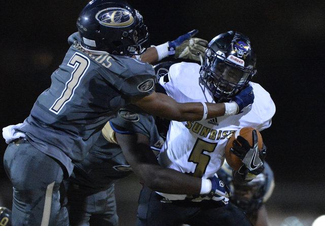 Sunrise Mountain receiver Xavier Kyle (5) tries to break a tackle during the Cheyenne High S ...