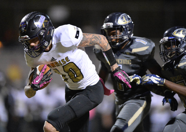 Sunrise Mountain senior Daltyn Pytrysson (10) runs with the football during the Cheyenne Hi ...