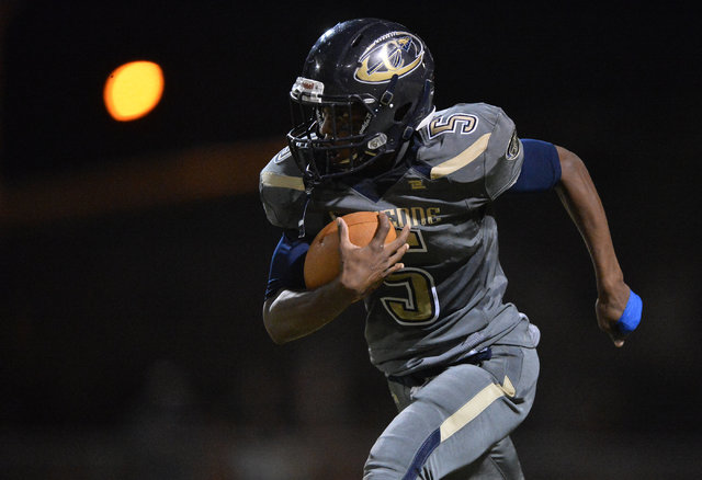 Cheyenne cornerback Deriontae Green (5) returns an interception during the Cheyenne High Sch ...