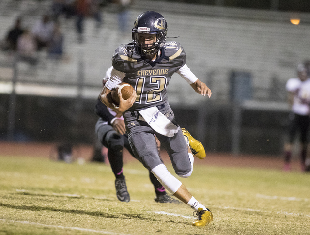 Cheyenne High School’s Matthew LaBonte (12) runs the ball against Sunrise Mountain Hig ...