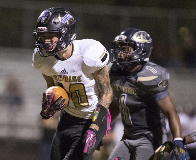 Sunrise Mountain High School’s Daltyn Pytrysson (10) runs the ball against Cheyenne Hi ...