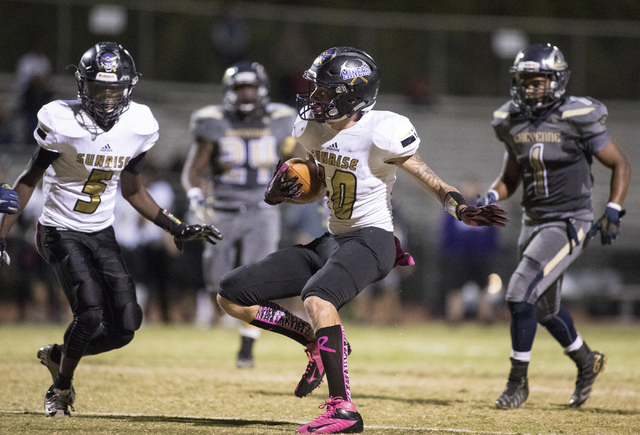 Sunrise Mountain High School’s Daltyn Pytrysson (10) runs the ball against Cheyenne Hi ...