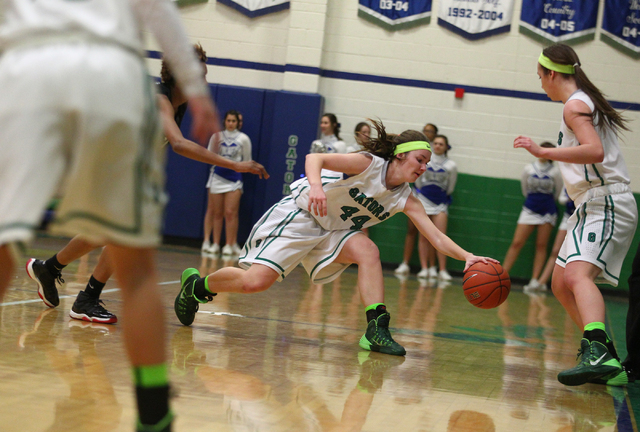 Green Valley’s Brooke Haney (44) gets control of the ball against Basic during the qua ...