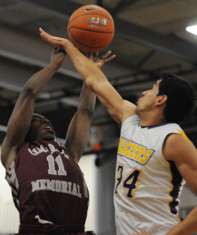 Cimarron-Memorial’s Tony Harrison Jr. (11) is blocked by Durango’s defender Alex ...