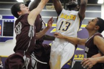 Durango’s Darryl Gaynor (13) takes a jump shot over the Cimarron-Memorial’s defe ...