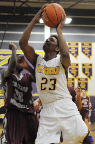 Durango’s Vee Price (23) takes a shot over Cimarron-Memorial’s defender JaDon Br ...