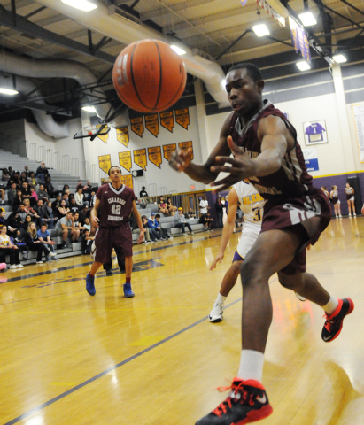 Cimarron-Memorial’s Tony Harrison Jr. (11) leaps to save the ball from going out of bo ...